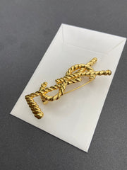 Elegant Golden Ribbed Brooch