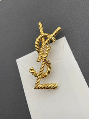 Elegant Golden Ribbed Brooch