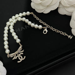 Pearl bow pendant necklace