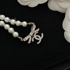 Pearl bow pendant necklace