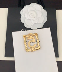 Gold Frame 5-character Brooch
