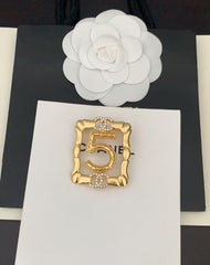 Gold Frame 5-character Brooch
