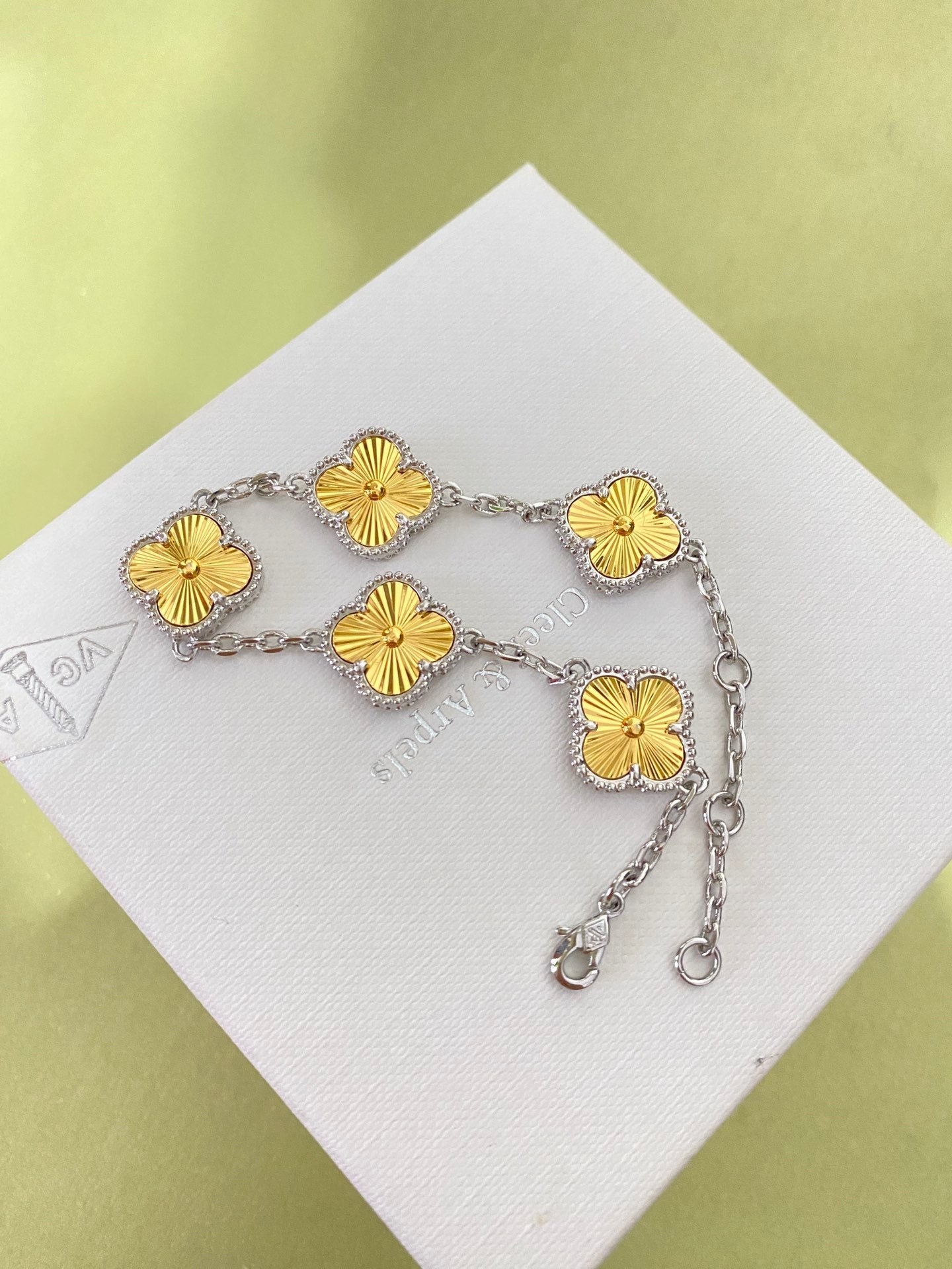 Gold four-leaf clover bracelet