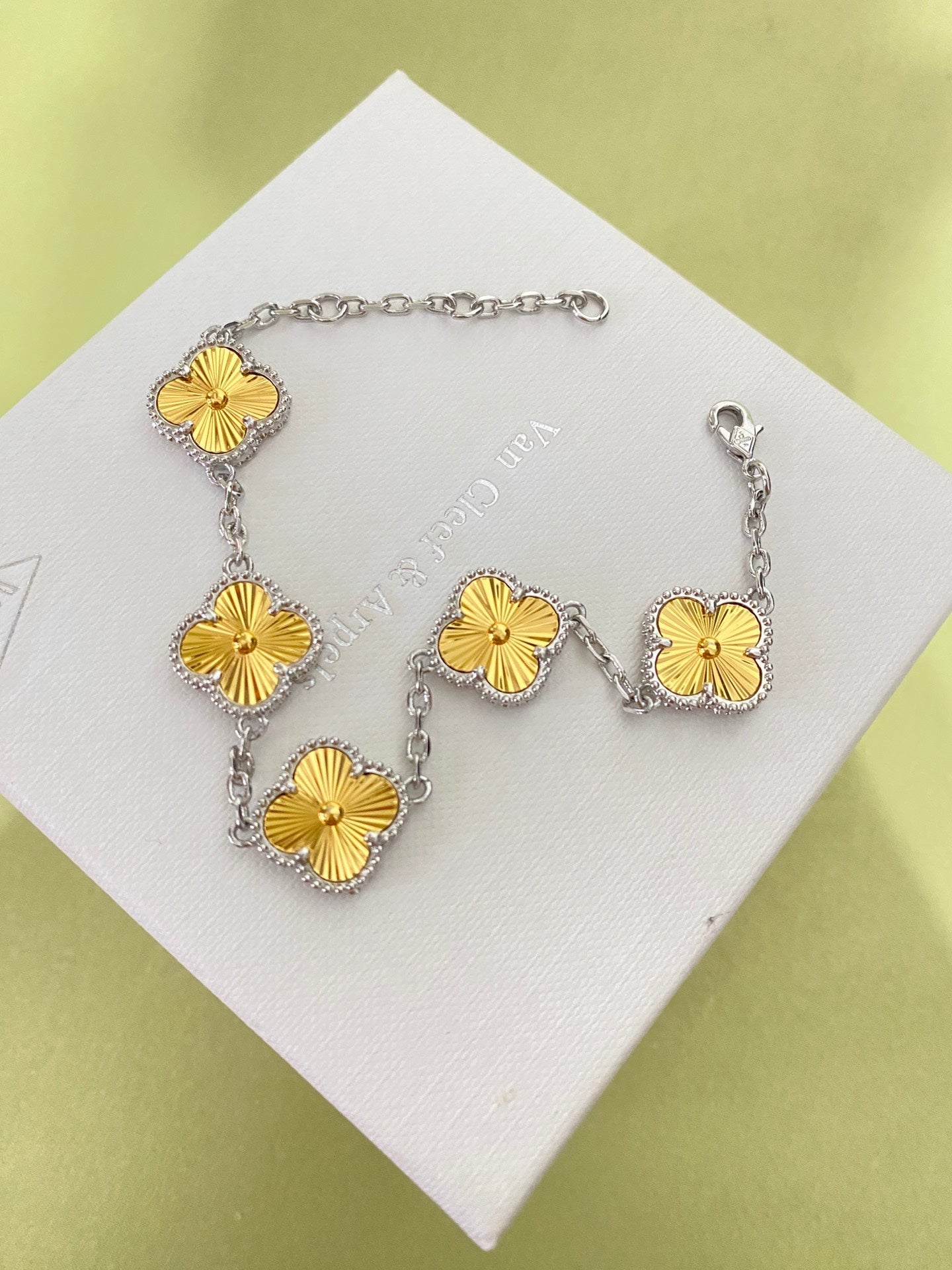 Gold four-leaf clover bracelet