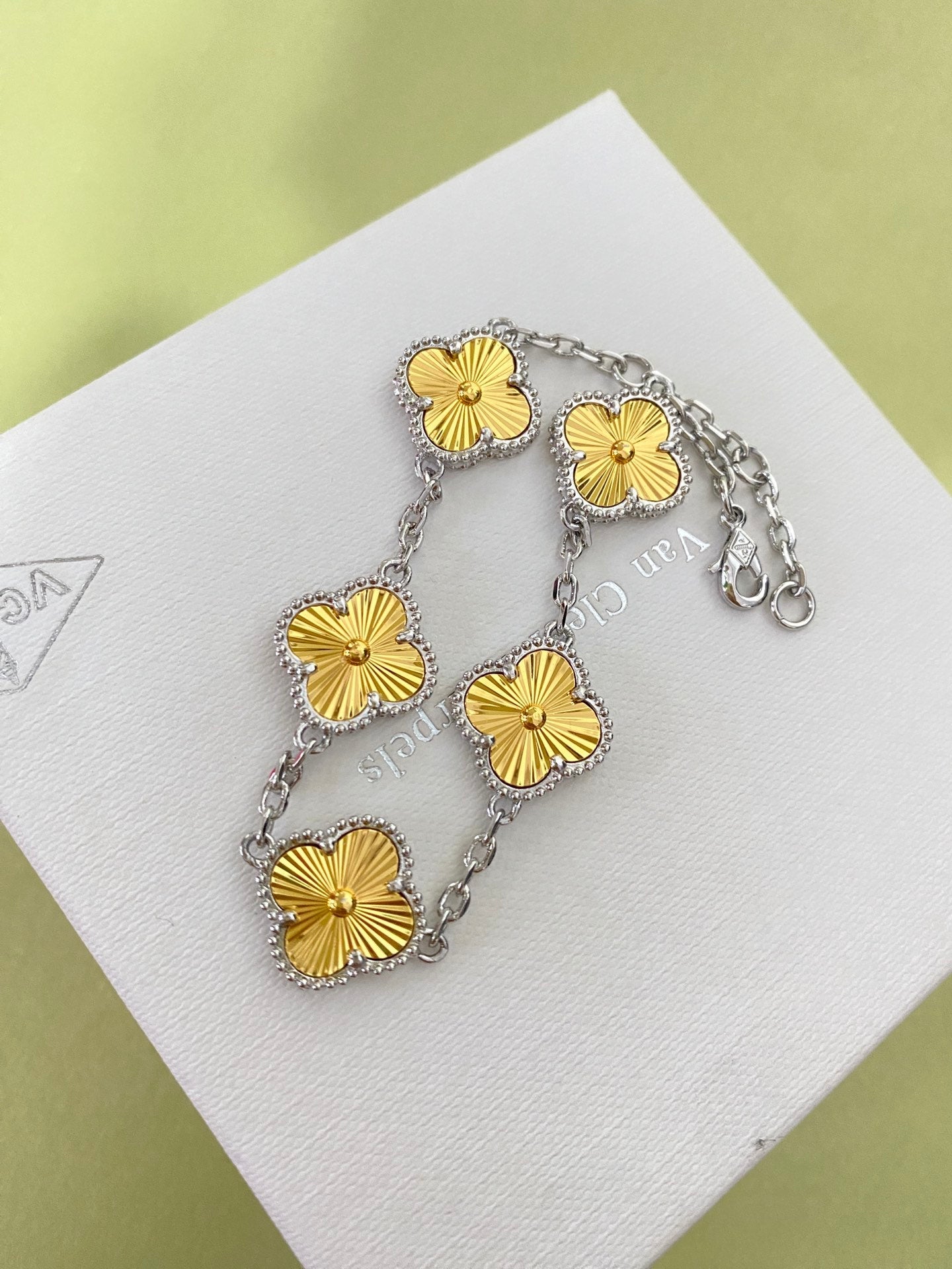 Gold four-leaf clover bracelet