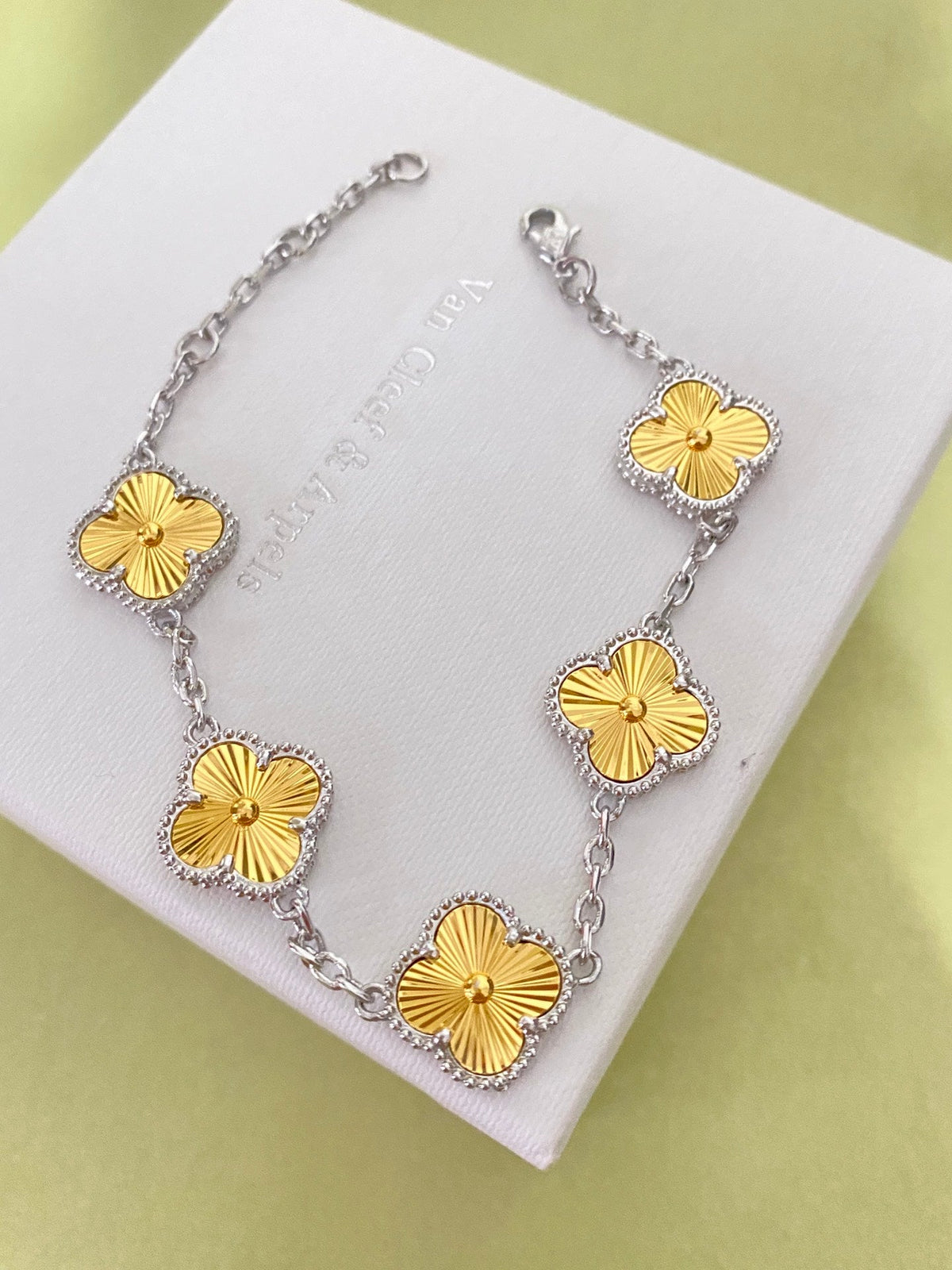 Gold four-leaf clover bracelet