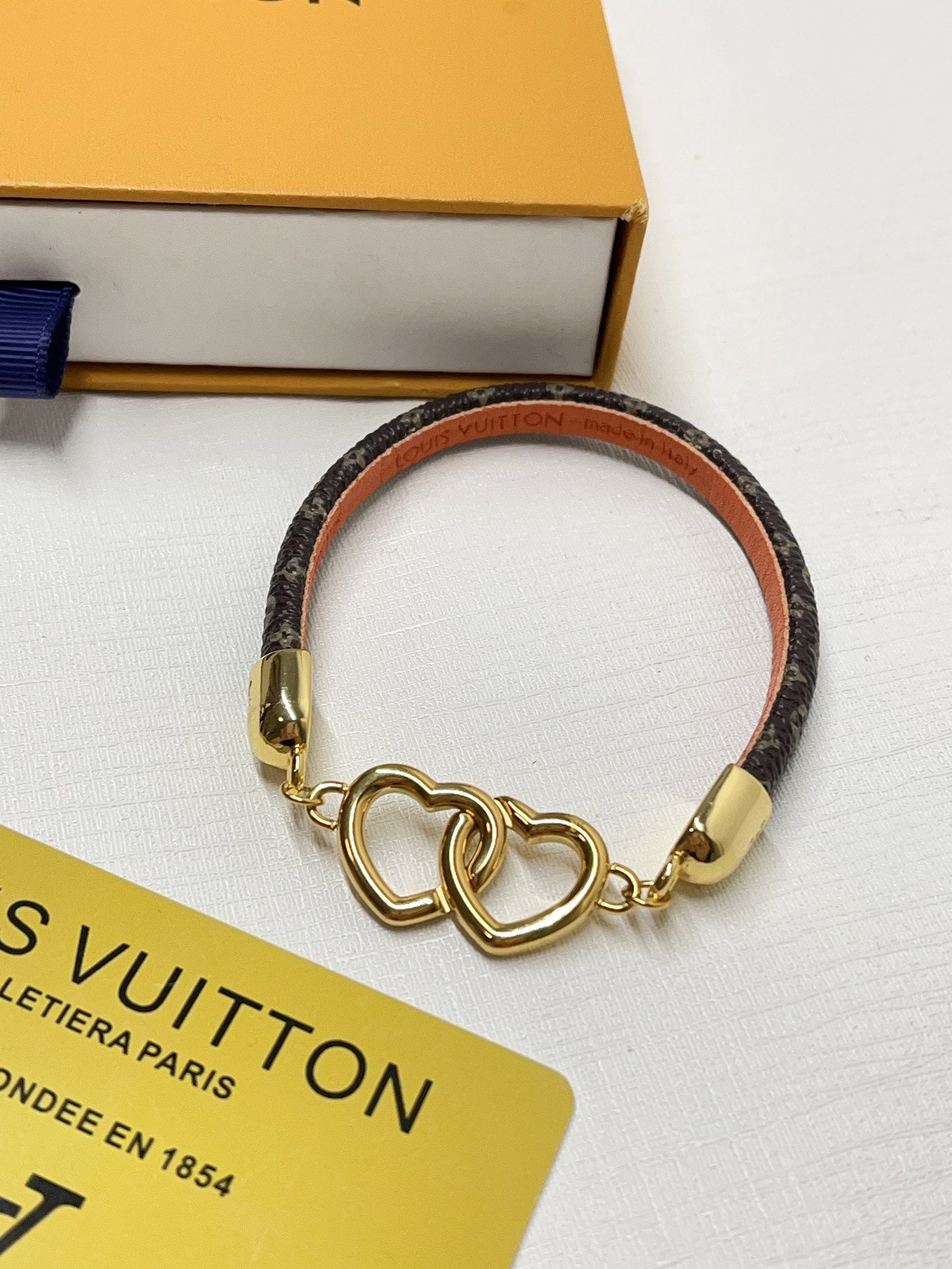 Interlocking heart leather bracelet