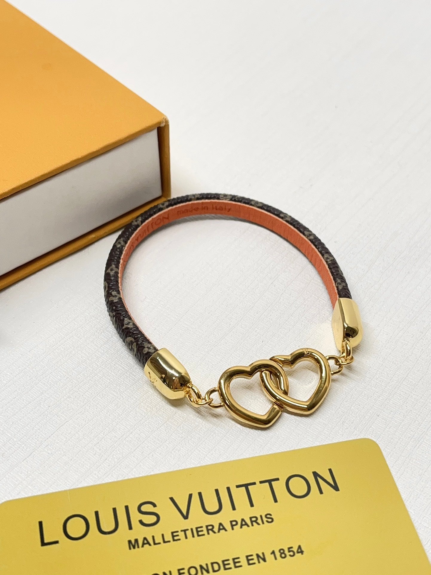 Interlocking heart leather bracelet