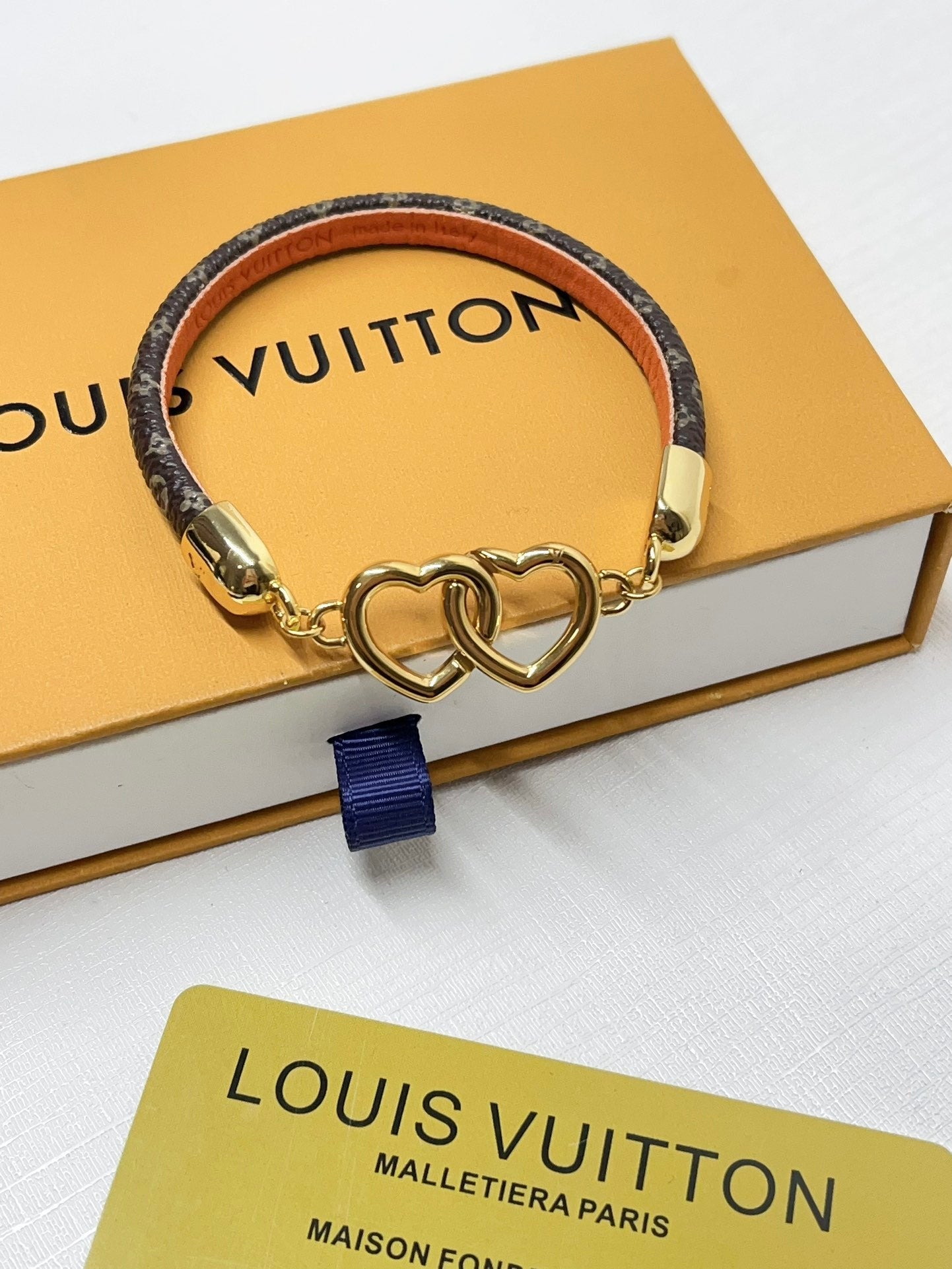 Interlocking heart leather bracelet