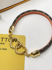 Interlocking heart leather bracelet