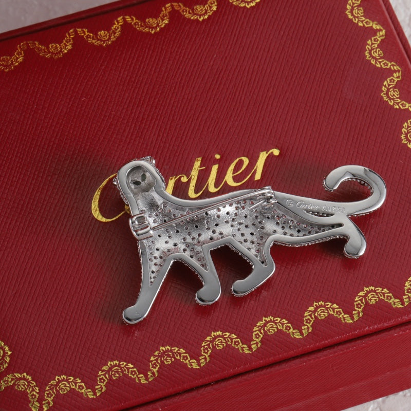 Diamond-encrusted leopard brooch