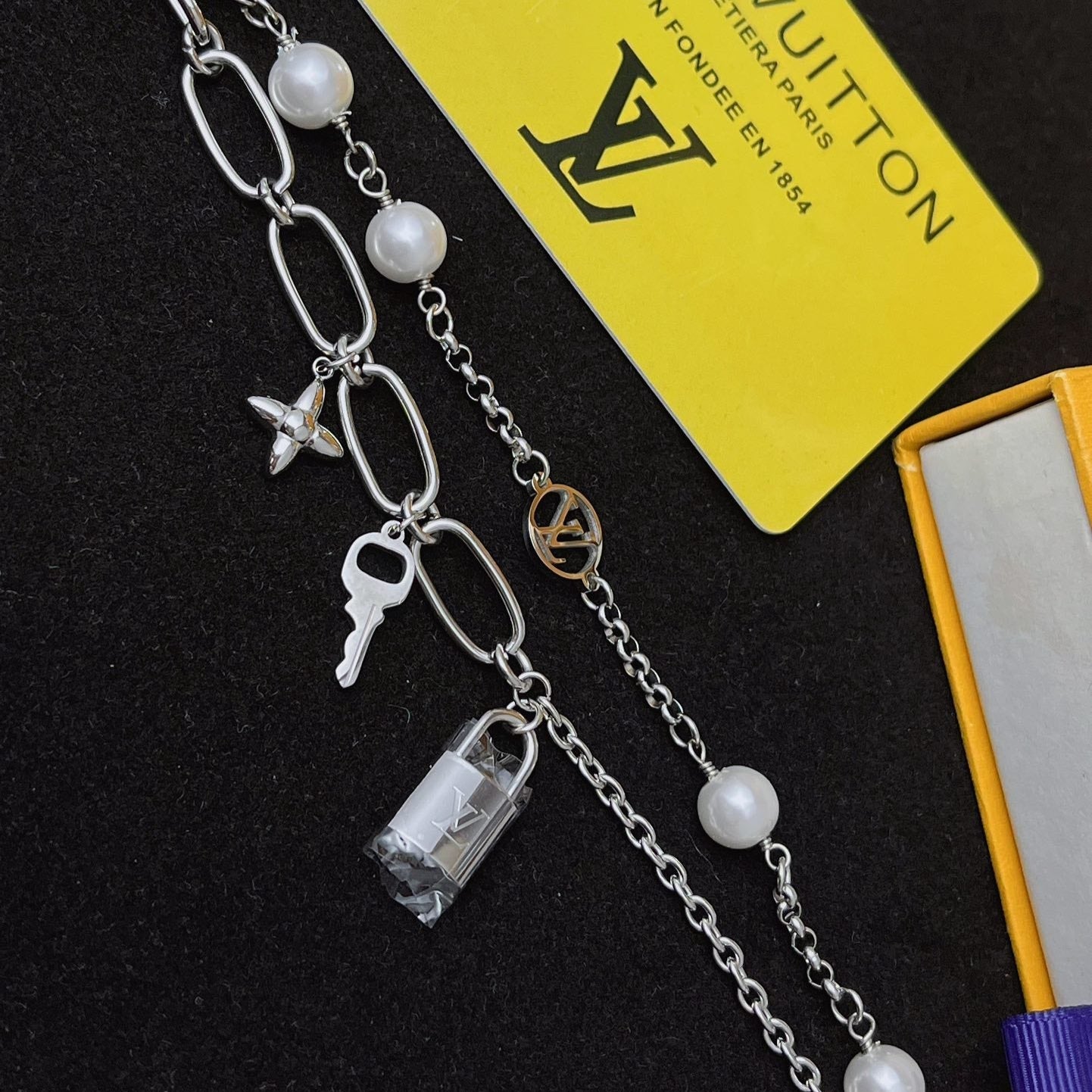 Floral lock pendant silver bracelet